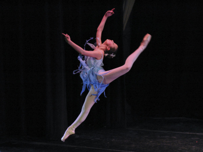 Blue Costumed Contemporary Ballet Dancer in Mid Leap